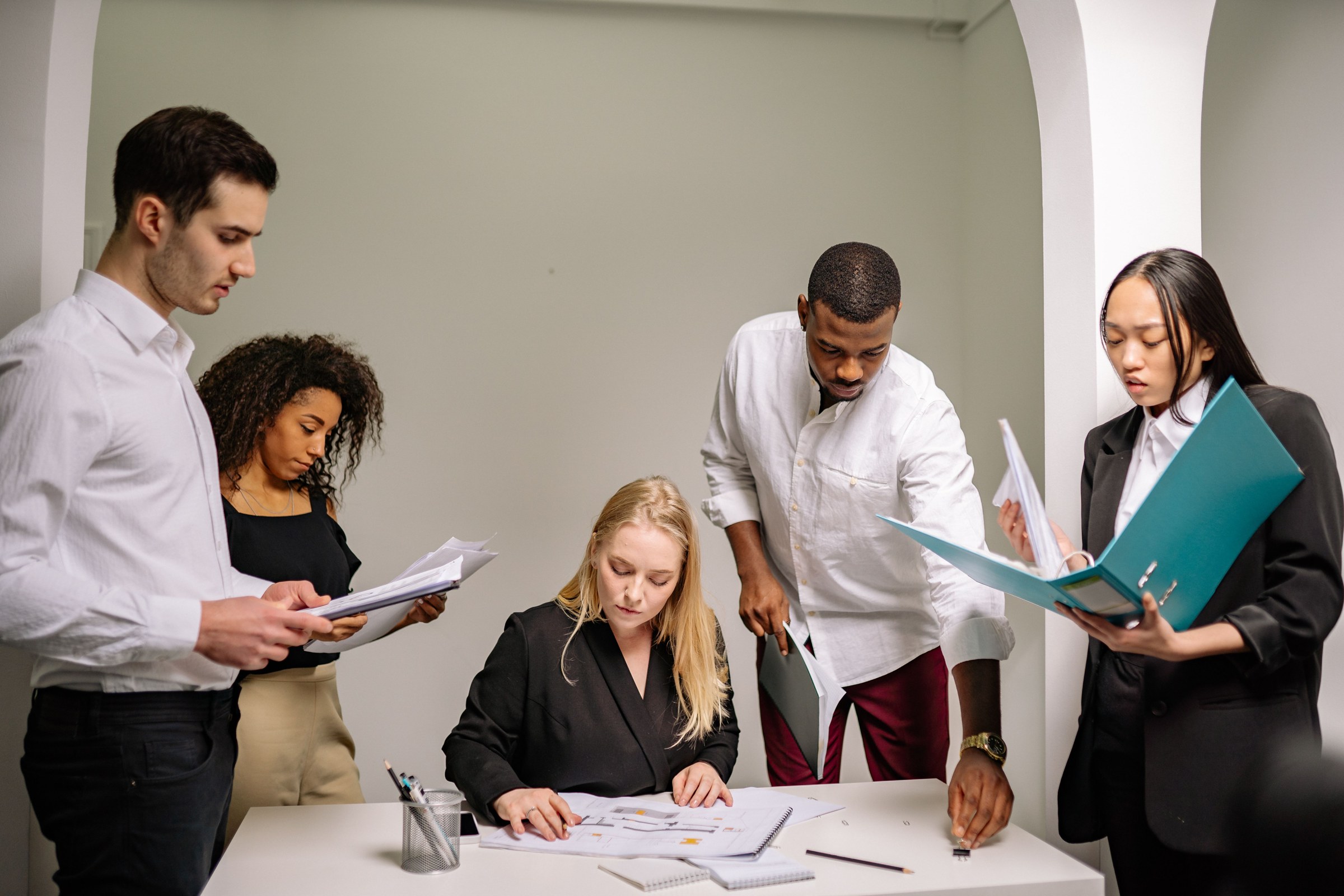 A team aligning plans around a shared table